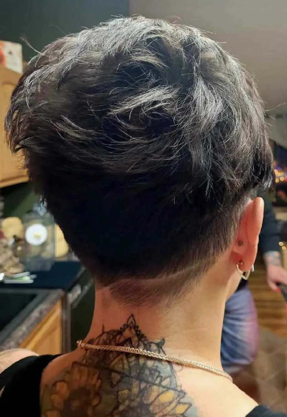 A back view of a short pixie cut on an attractive brunette, cut by Rose Bower at Studio 101 Salon in Morgnatown, WV.